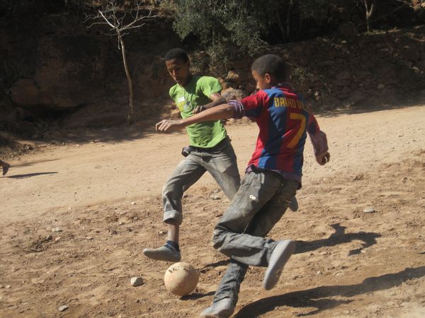 kids at the mountains playing football