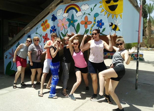 volunteers having fun painting murals 